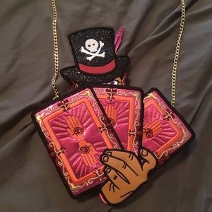 Danielle Nicole Dr. Facilier crossbody bag